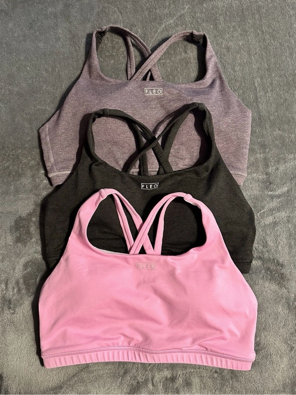 FLEO Isla sports bras, size large, medium support, used but very good condition.